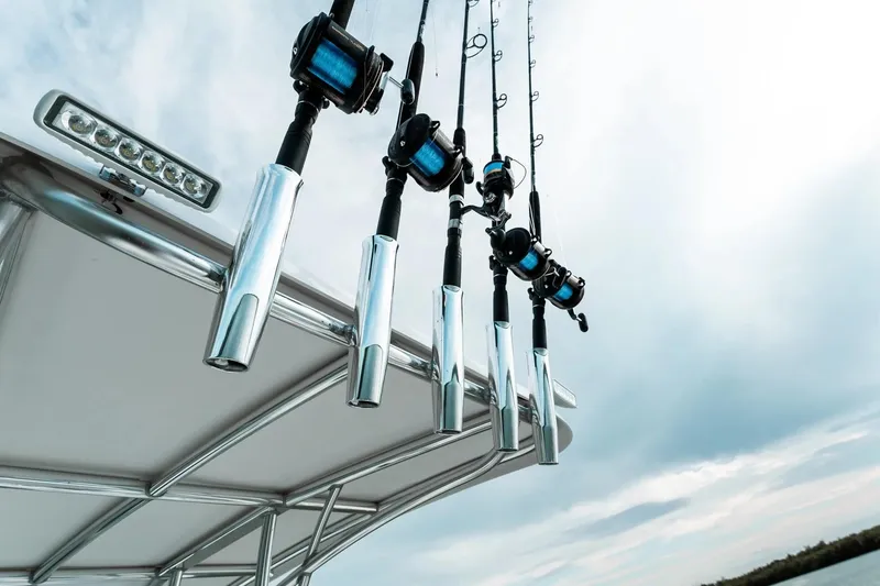 Slide: The Image of Fishing rods on a 2026 Twin Vee 240 STX CC boat. - 12