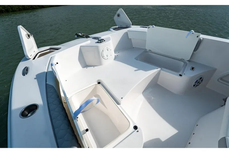 Slide: The Image of Manufacturer Provided Image: 2026 Twin Vee 240 STX CC boat interior with open storage compartments and seating. - 5
