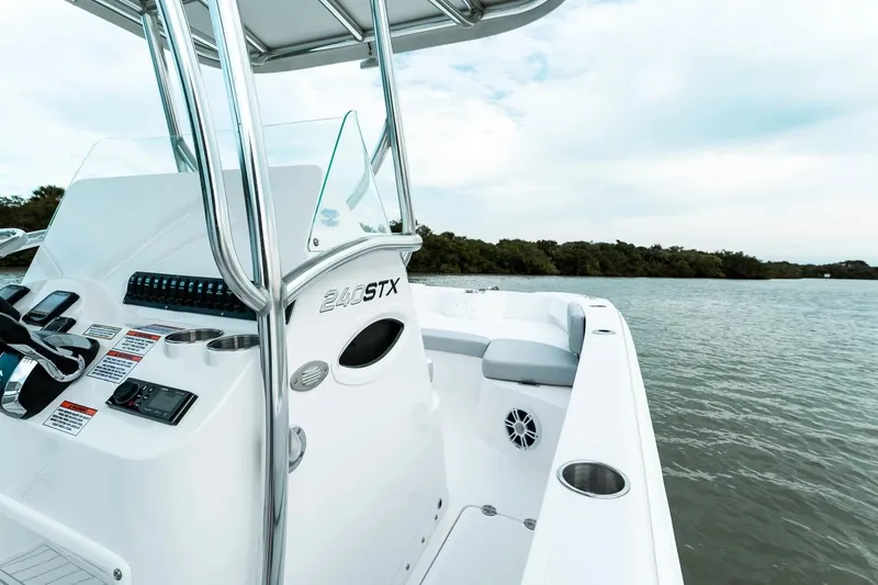 Slide: The Image of 2026 Twin Vee 240 STX CC boat on calm water. - 7