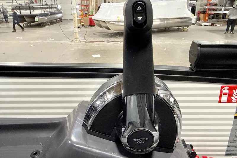 Slide: The Image of Throttle control of 2026 Bennington 23 M Swingback boat in a manufacturing facility. - 13