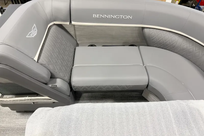 Slide: The Image of 2026 Bennington 23 M Swingback boat interior with luxurious gray seating and elegant design. - 8