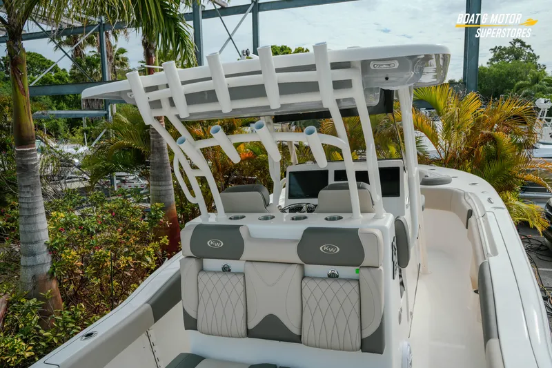 Slide: The Image of 2026 Key West 291 FS boat with sleek design and modern features, surrounded by tropical foliage. - 10