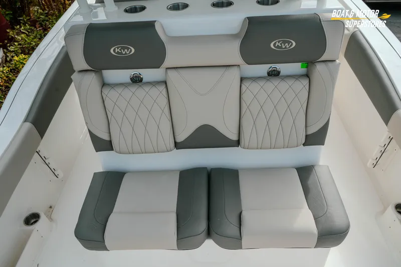 Slide: The Image of 2026 Key West 291 FS boat seating with gray and white upholstery. - 11