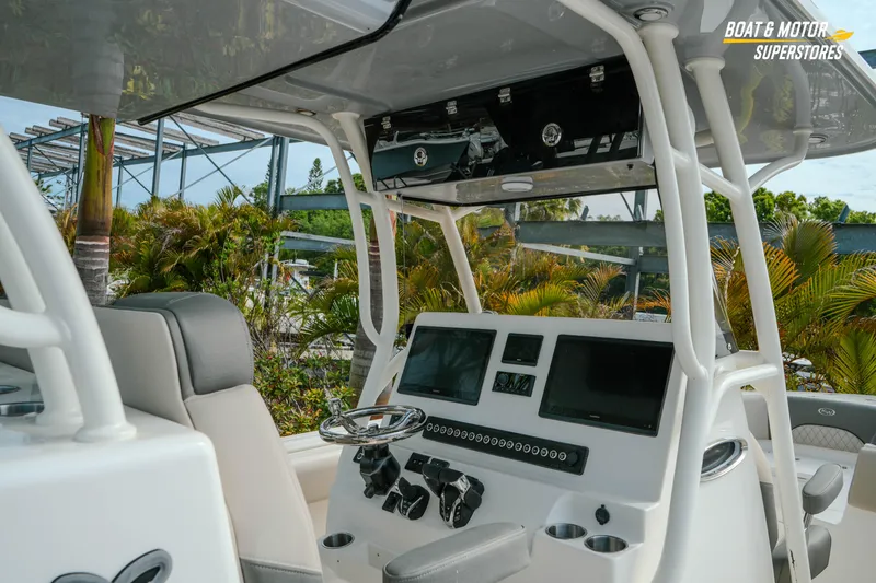 Slide: The Image of 2026 Key West 291 FS boat cockpit with modern controls and dual screens. - 17