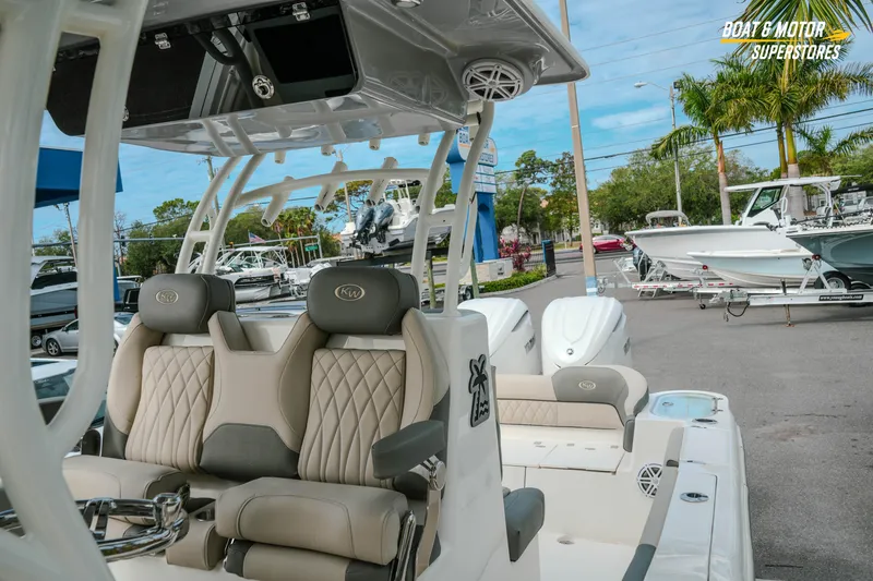 Slide: The Image of 2026 Key West 291 FS boat interior with luxurious seating at a dealership. - 19