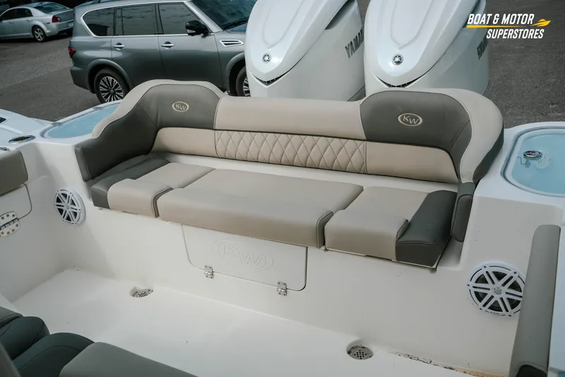 Slide: The Image of 2026 Key West 291 FS boat interior with cushioned seating and Yamaha engines. - 22