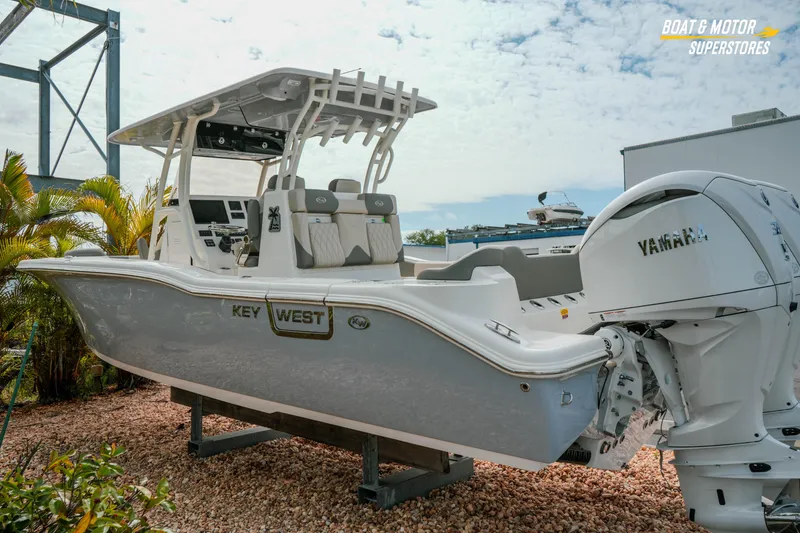 Slide: The Image of 2026 Key West 291 FS boat with Yamaha engine, displayed outdoors. - 6