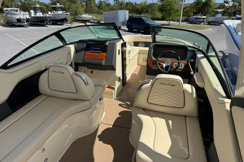 Slide: The Image of 2026 Chris-Craft Sportster 28 interior with luxurious seating and modern dashboard. - 11