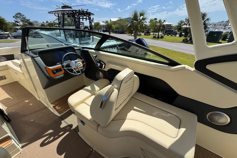 Slide: The Image of 2026 Chris-Craft Sportster 28 boat interior with luxurious seating and modern dashboard. - 14