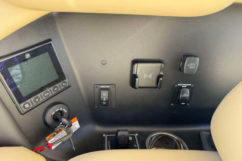 Slide: The Image of 2026 Chris-Craft Sportster 28 dashboard with controls and display panel. - 15