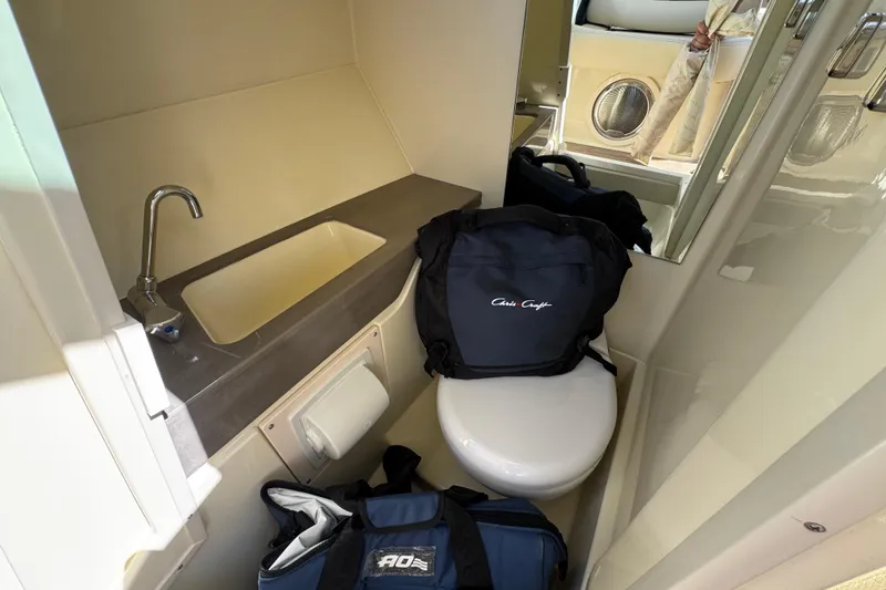 Slide: The Image of Interior of 2026 Chris-Craft Sportster 28 bathroom with sink and toilet. - 17