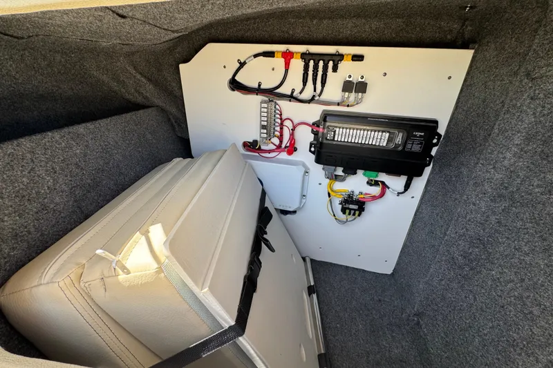 Slide: The Image of Electrical panel and storage area in 2026 Chris-Craft Sportster 28 boat. - 24