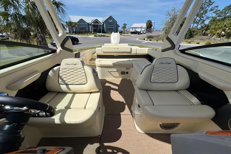 Slide: The Image of 2026 Chris-Craft Sportster 28 interior with luxurious beige seating and modern design. - 25