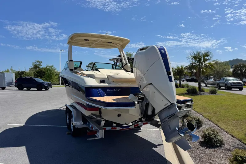 Slide: The Image of 2026 Chris-Craft Sportster 28 boat on trailer in sunny parking lot. - 3