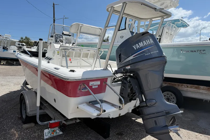 Slide: The Image of 2010 Sea Hunt XP 19 boat with Yamaha outboard motor on trailer. - 6