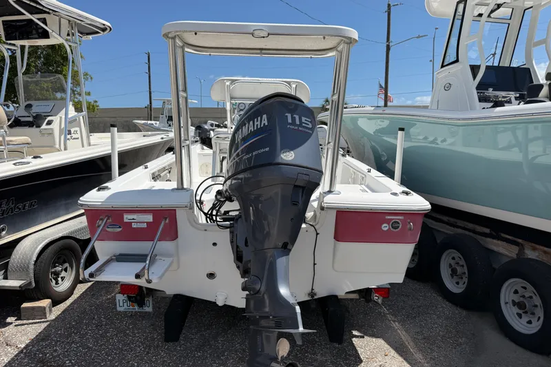 Slide: The Image of 2010 Sea Hunt XP 19 boat with Yamaha 115 engine, parked on a trailer. - 7