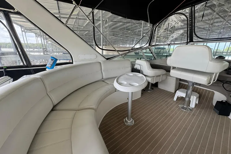 Slide: The Image of Interior of 1999 Carver 450 Voyager Pilothouse with seating and helm station. - 19