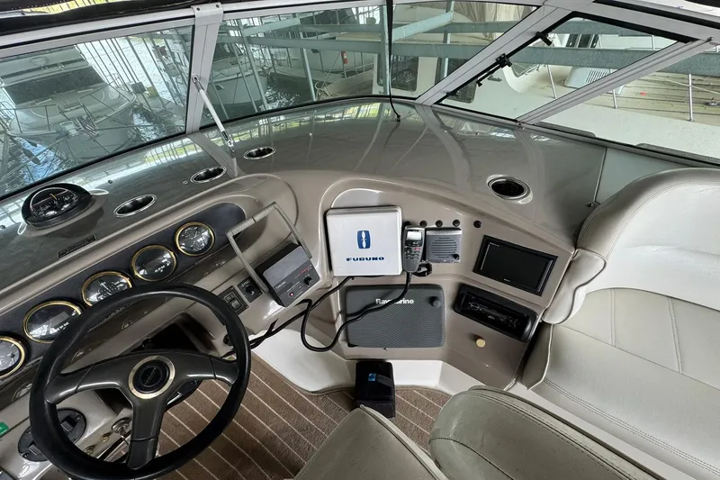 Slide: The Image of Interior cockpit of 1999 Carver 450 Voyager Pilothouse with navigation equipment and steering wheel. - 24