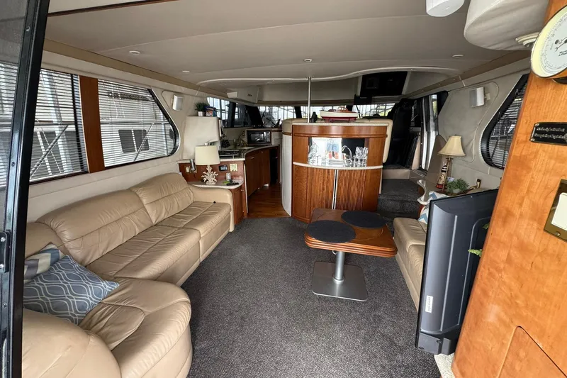 Slide: The Image of Luxurious interior of 1999 Carver 450 Voyager Pilothouse with leather seating and modern amenities. - 26