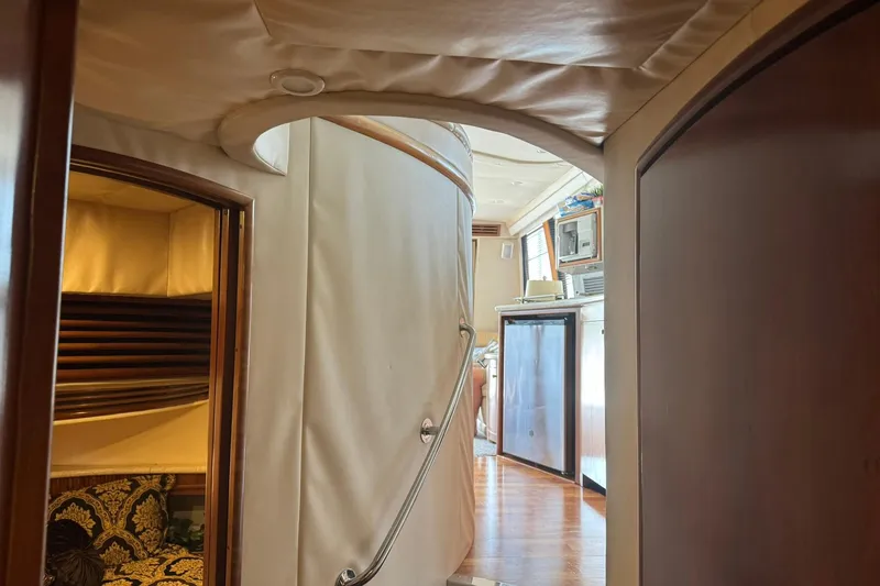 Slide: The Image of Interior view of 1999 Carver 450 Voyager Pilothouse, featuring cozy cabin and kitchenette. - 35