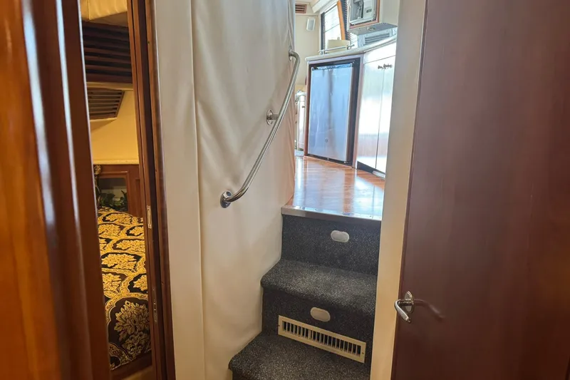 Slide: The Image of Interior view of 1999 Carver 450 Voyager Pilothouse, featuring stairs and cabin entrance. - 36