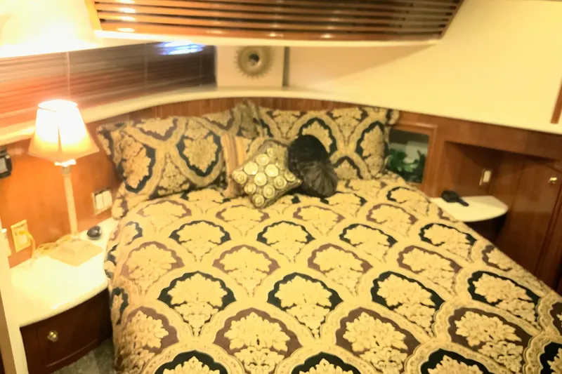 Slide: The Image of Luxurious bedroom interior of 1999 Carver 450 Voyager Pilothouse yacht. - 40