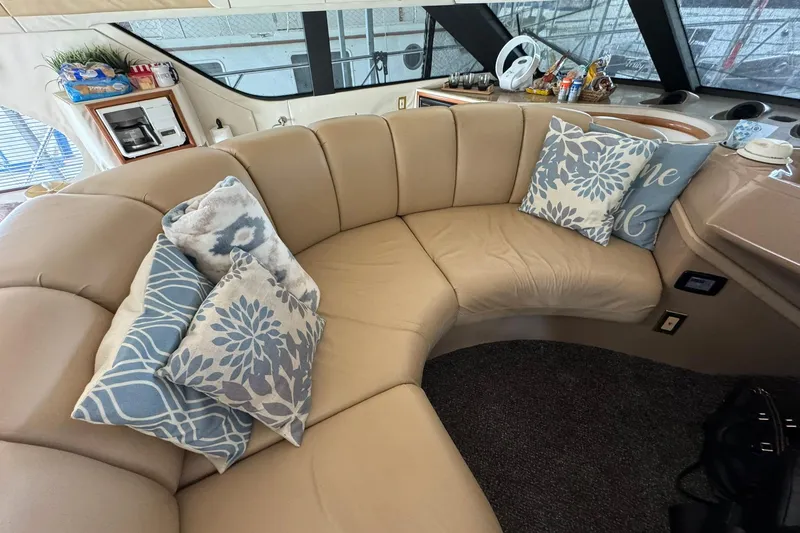 Slide: The Image of Luxurious interior of 1999 Carver 450 Voyager Pilothouse with plush seating and decorative pillows. - 51