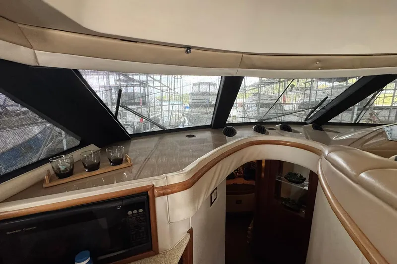 Slide: The Image of Interior view of 1999 Carver 450 Voyager Pilothouse with large windows and modern design. - 55