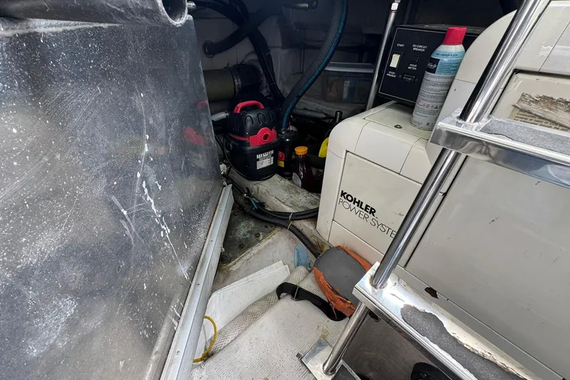 Slide: The Image of Engine room of 1999 Carver 450 Voyager Pilothouse with Kohler power system. - 64