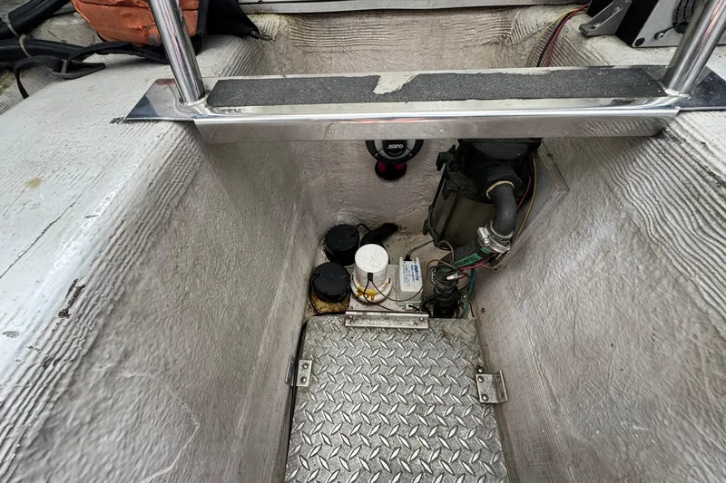 Slide: The Image of Bilge area of a 1999 Carver 450 Voyager Pilothouse with mechanical components. - 65