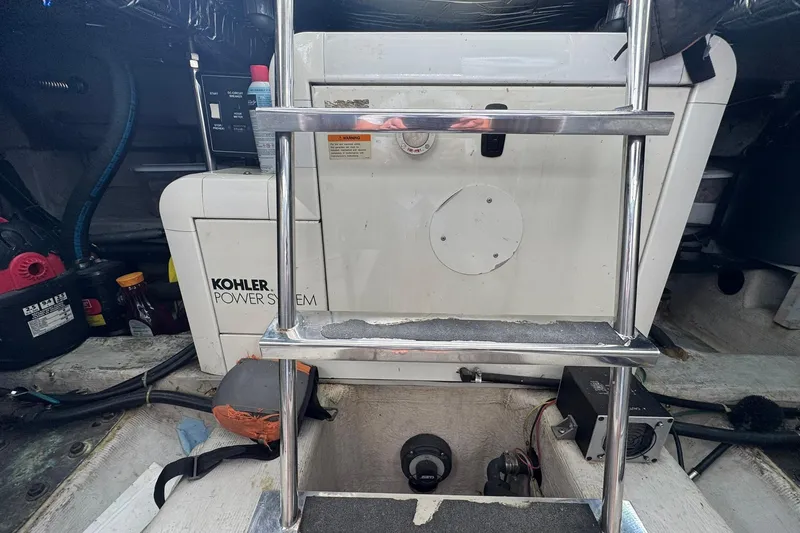 Slide: The Image of Engine room of 1999 Carver 450 Voyager Pilothouse with Kohler power system. - 66