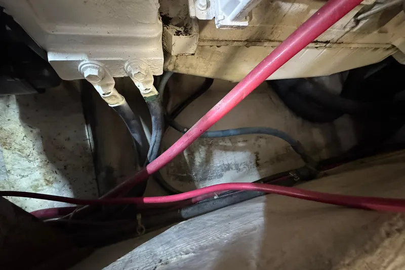 Slide: The Image of Engine compartment of 1999 Carver 450 Voyager Pilothouse with visible cables and components. - 70