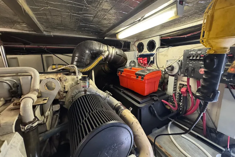 Slide: The Image of Engine room of 1999 Carver 450 Voyager Pilothouse with tools and equipment. - 71