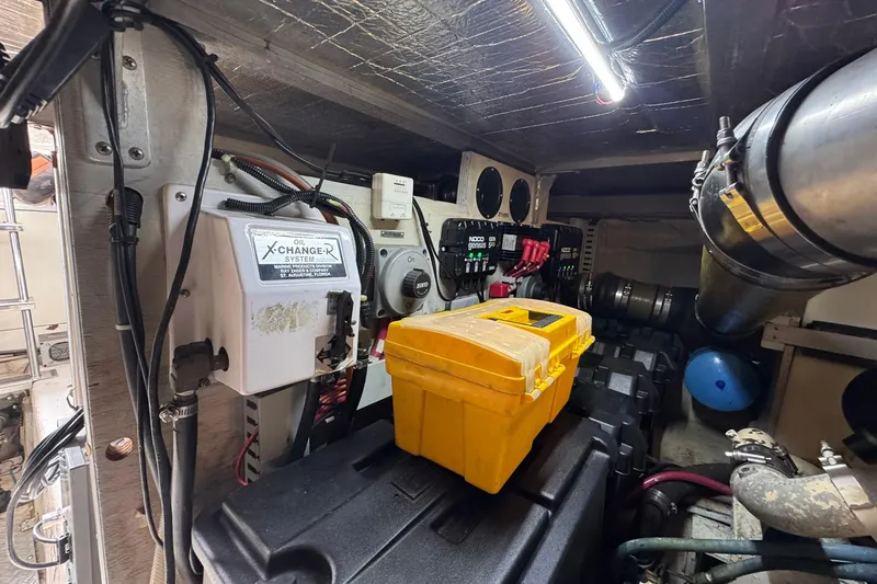 Slide: The Image of Engine room of 1999 Carver 450 Voyager Pilothouse with tools and equipment. - 73
