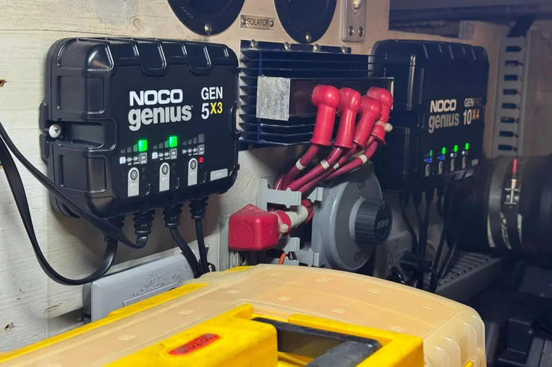 Slide: The Image of NOCO Genius chargers in a 1999 Carver 450 Voyager Pilothouse engine room. - 75