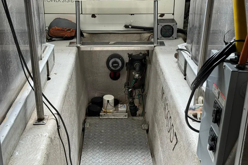 Slide: The Image of Interior view of a 1999 Carver 450 Voyager Pilothouse engine compartment. - 76