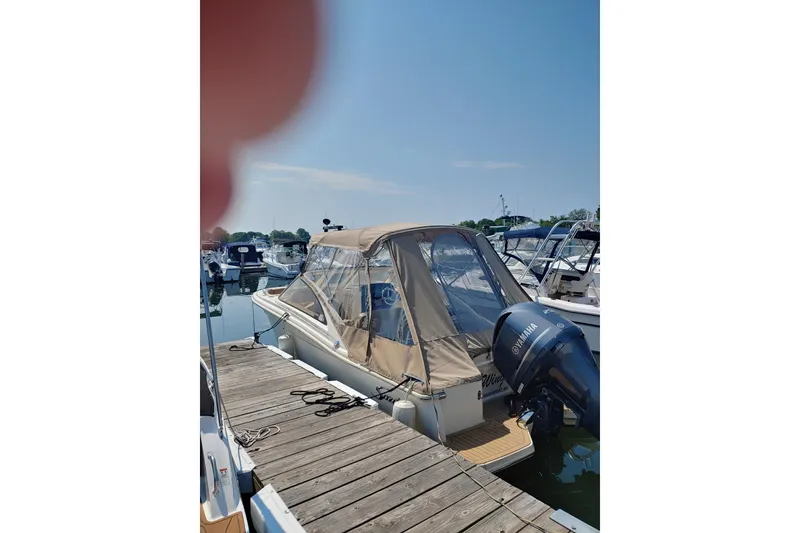 Slide: The Image of 2019 Scout 235 Dorado boat docked with Yamaha outboard motor. - 5