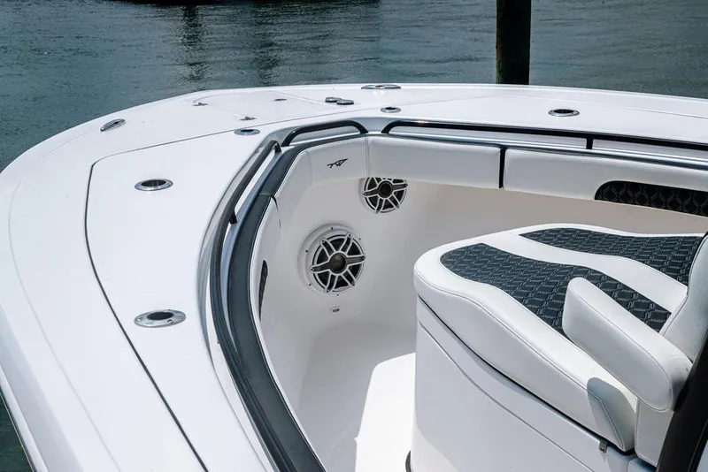 Slide: The Image of 2023 Tidewater 282 CC Adventure Bluewater boat, featuring sleek seating and modern design. - 11