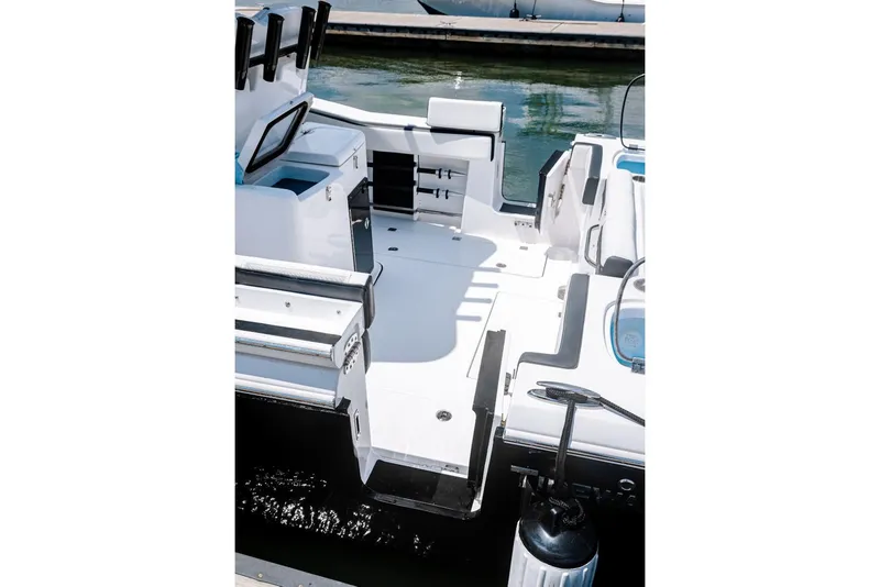 Slide: The Image of 2023 Tidewater 282 CC Adventure Bluewater boat with twin 250 engines, rear deck view. - 17