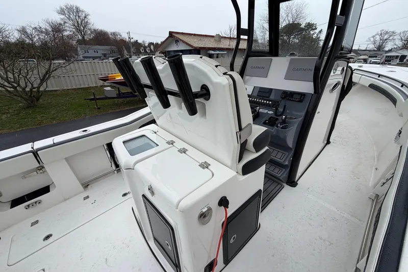 Slide: The Image of 2023 Tidewater 282 CC Adventure Bluewater boat interior with Garmin navigation system. - 20