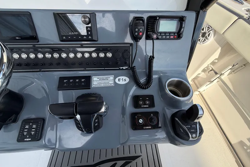 Slide: The Image of Control panel of 2023 Tidewater 282 CC Adventure Bluewater boat with navigation and communication equipment. - 25