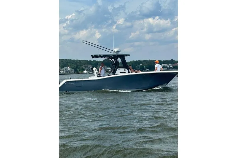 Slide: The Image of 2023 Tidewater 282 CC Adventure Bluewater boat docked with dual 250 engines. - 3