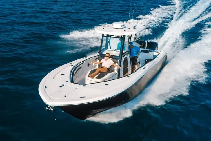 Slide: The Image of 2023 Tidewater 282 CC Adventure Bluewater boat deck, featuring sleek design and spacious layout. - 7