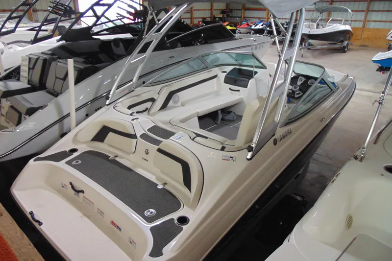 Slide: The Image of 2016 Yamaha Boats AR190 in showroom, featuring sleek design and spacious interior. - 3