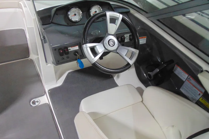 Slide: The Image of 2016 Yamaha Boats AR190 cockpit with steering wheel and dashboard controls. - 7
