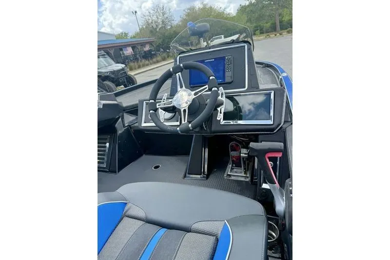 Slide: The Image of 2023 Ranger Z520R boat cockpit with advanced navigation and control systems. - 11