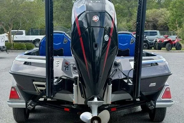 Slide: The Image of 2023 Ranger Z520R boat with powerful outboard motor, parked outdoors. - 6