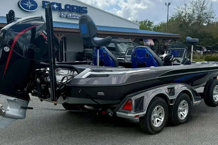 Slide: The Image of 2023 Ranger Z520R boat on trailer at Polaris dealership, featuring sleek design and powerful engine. - 7