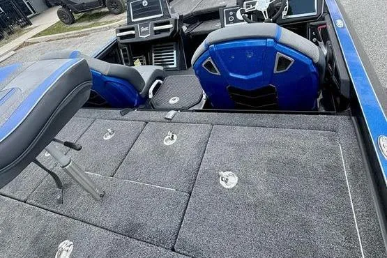 Slide: The Image of 2023 Ranger Z520R boat interior with blue seats and advanced dashboard controls. - 9