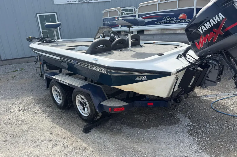 Slide: The Image of 2003 Champion 187 CX boat with Yamaha VMAX engine on a trailer. - 4